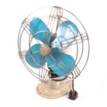 A mid-century 12" Aermaster desk fan, blue propellers with steel cage