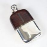 A late Victorian crocodile skin and silver-mounted hip flask, with silver cup, inscribed to the base