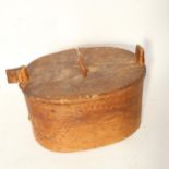 A Swedish bentwood box and cover, containing darning mushrooms etc, length 26cm