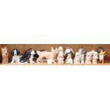 A collection of dog figures, including Sylvac, tallest 14cm