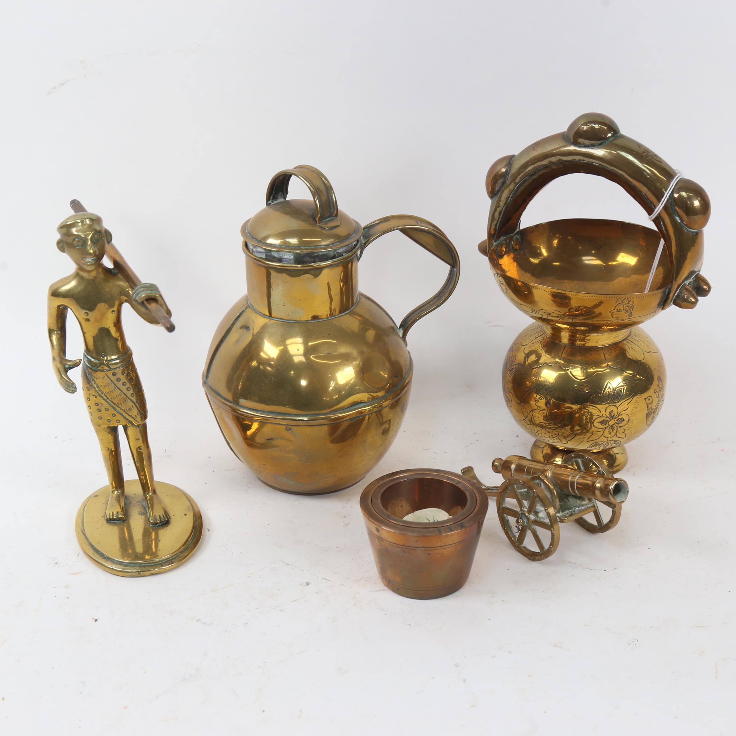 A brass Guernsey milk jug, 18cm, a brass figure, nesting pair of 19th century apothecary's