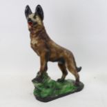 An Art Deco style painted plaster sculpture, Alsatian on rocky outcrop, unsigned, height 50cm