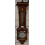 A carved oak-cased barometer, by Negretti & Zambra, height 65cm