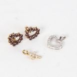 A pair of 14ct gold and garnet set heart-shaped earrings, a white gold heart-shaped pendant, and a