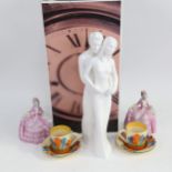 A pair of Clarice Cliff Crocus pattern coffee cans and saucers, 2 porcelain crinoline lady boxes,