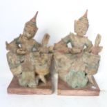 A pair of Thai painted and gilded plaster dancing figures, height 47cm