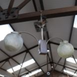 An Art Deco style ceiling light fitting, with moulded glass globes, 58cm across