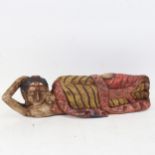 A carved and painted hardwood Buddha, length 50cm
