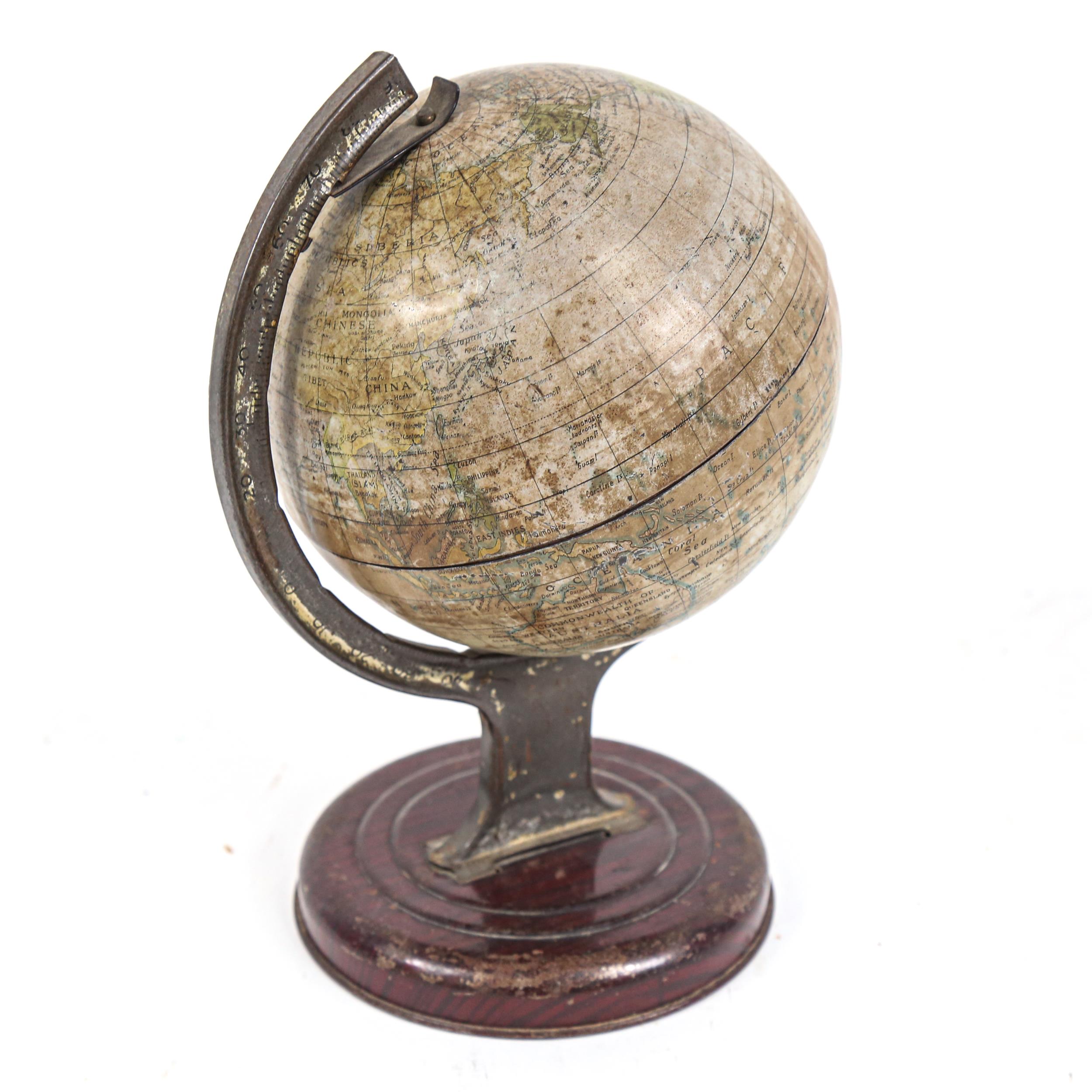 A Vintage Chad Valley tinplate desk-top terrestrial globe, height 20cm