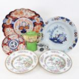 A large Delft tin glaze spongeware pottery charger, Chinese and other porcelain plates, a Doulton