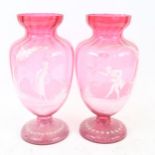 A pair of Victorian Mary Gregory style cranberry glass baluster vases, figural decoration, height