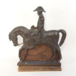 A cast bronze door stop in the form of a mounted soldier H 34cm