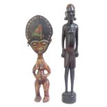 A carved African hardwood figure, 70cm, and a smaller carved wood figure with applied beadwork
