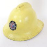 A painted Hampshire Fire Brigade fireman's helmet