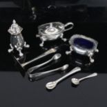 A silver plated 3-piece cruet set, with plastic blue liners, a silver food pusher, plated sugar nips