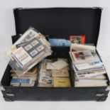 A large quantity of Vintage loose postcards, postage stamps and ephemera