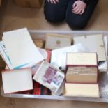 A large boxful of loose postage stamps, albums etc