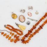 A group of silver and amber jewellery, to include necklace and bracelet, relief cameos, pendants etc
