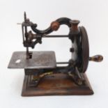A 19th century Agenoria painted and gilded cast-iron sewing machine by Maxfield & Co Birmingham