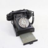 A Vintage black Bakelite dial telephone