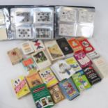 Albums of playing cards, packs of cards etc