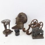 A brass vase stand with Satyr supports, 13cm, a winged lion, a small pottery figure etc