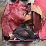 A large case full of skins, leather scraps, textiles etc