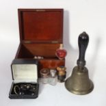 A mahogany box and contents, including 2 glass bottles with silver plated tops, width 23cm, and a