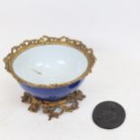 A 19th century porcelain bowl with scrolled and pierced gilt-metal mounts, diameter 19cm, and a