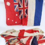 A collection of Vintage flags, including Union Jacks, various sizes