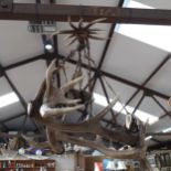 A Vintage ceiling light fitting made from stag's antlers, 69cm across