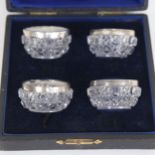 A cased set of 4 glass and silver-mounted salts