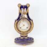 A replica Marie-Antoinette clock from the Victoria & Albert Museum, gilded blue glaze porcelain in