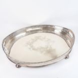 A Mappin & Webb silver plate on copper oval galleried tea tray, with scrolled engraved decoration,