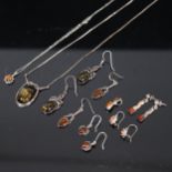 A collection of silver and amber set jewellery, to include a pendant and necklace, drop earrings etc