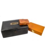 3 leather-covered boxes, comprising a tan leather jewel box, width 30cm, a smaller brown leather