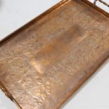 A Newlyn style Arts and Crafts copper tea tray, with embossed design, 55cm x 35cm