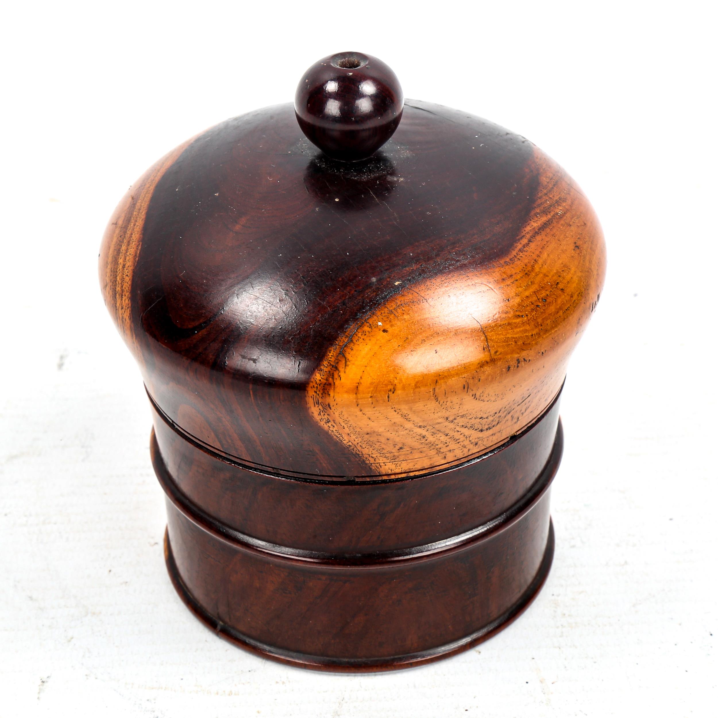 A 19th century lignum vitae string box, height 11.5cm, diameter 9cm Good condition