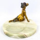 A circular onyx dish, surmounted by a gilt patinated bronze naked woman, diameter 20cm Very good