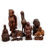 A group of Chinese wood carvings, mainly early to mid-20th century, including a seated Buddha,