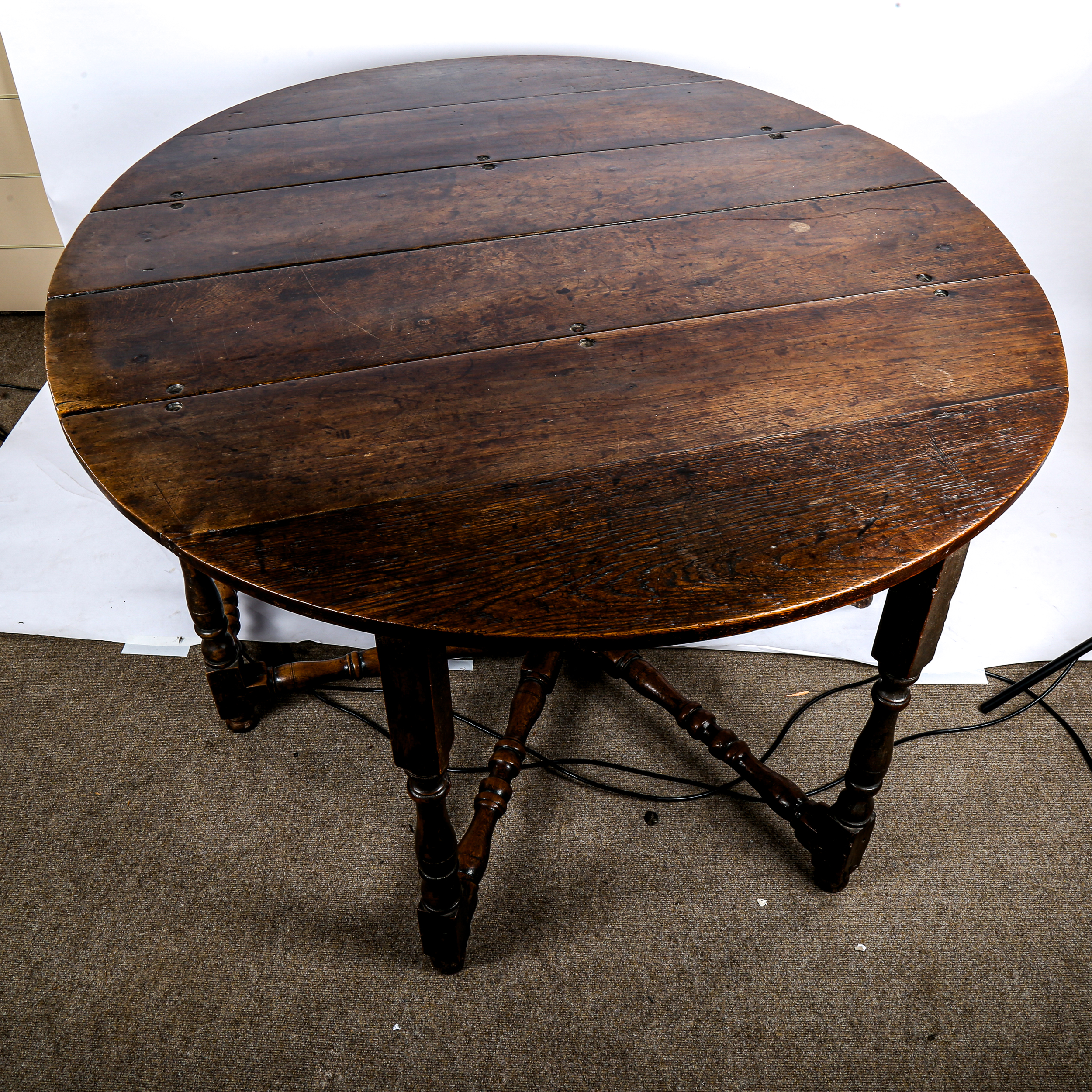 A large 17th/18th century oak gateleg dining table, on ring-turned legs with two frieze - Image 2 of 3