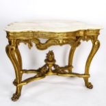 An ornate 19th century French carved giltwood console table, with original moulded and shaped