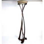 A designer bronze patinated metal standard lamp, with moulded frosted glass shade, shade diameter