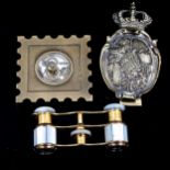 A pair of mother-of-pearl and gilt-brass opera glasses, a commemorative bronze paperweight, and a