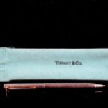 TIFFANY & CO - a sterling silver T-clip retractable ballpoint pen, engine turned decoration, length