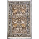 A Persian handmade fine wool rug, leopard hunting antelope with floral border, 152cm x 95cm