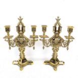 A pair of 19th century polished brass Gothic style twin-branch candelabra, height 36cm Good