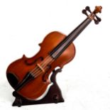 Reuge Swiss made carved wooden-cased clockwork miniature cello on stand, length 25cm