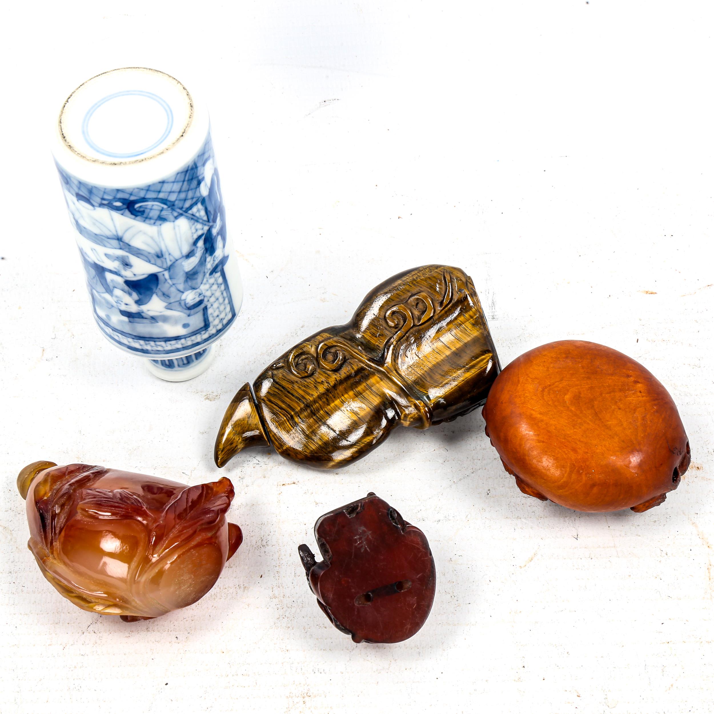 A group of Oriental cabinet items, including a relief carved tigers eye snuff bottle and stopper, - Image 3 of 3