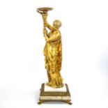 A 19th century gilt-bronze lamp base, supported by a robed Classical female figure, standing on